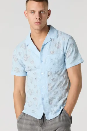 Haut boutonné en tricot de pointelle fleuri