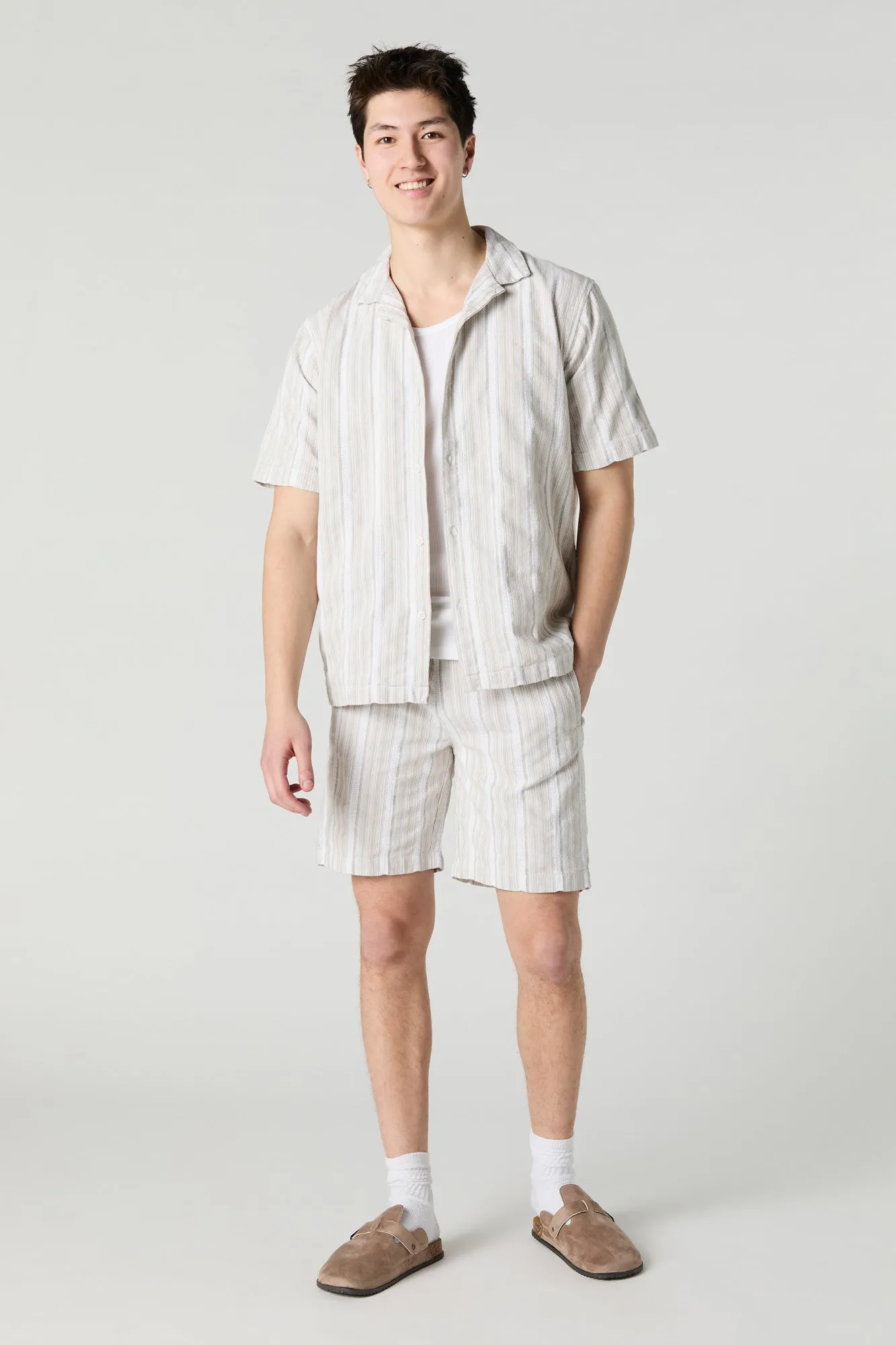 Haut boutonné en tricot rayé