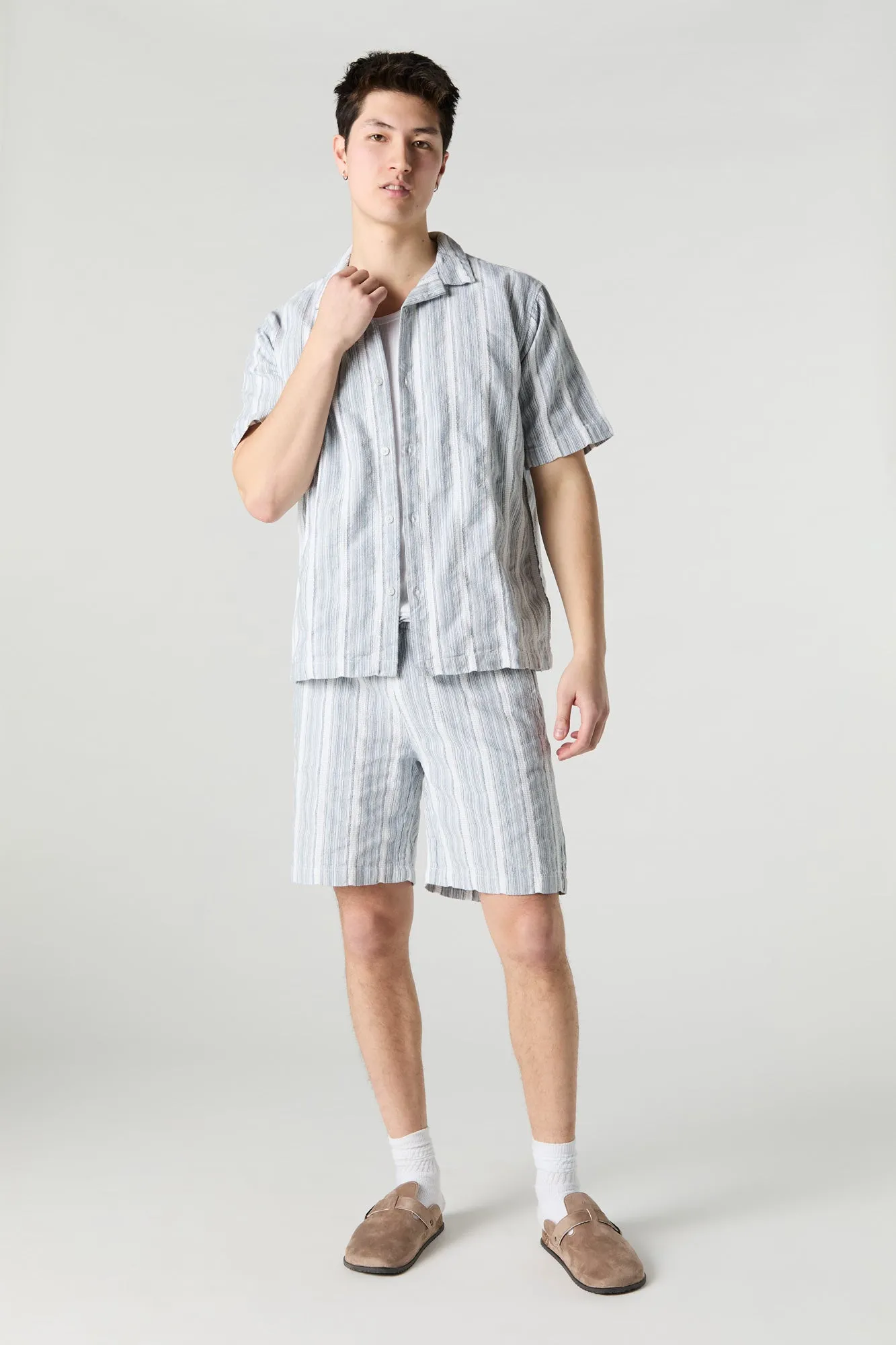 Haut boutonné en tricot rayé